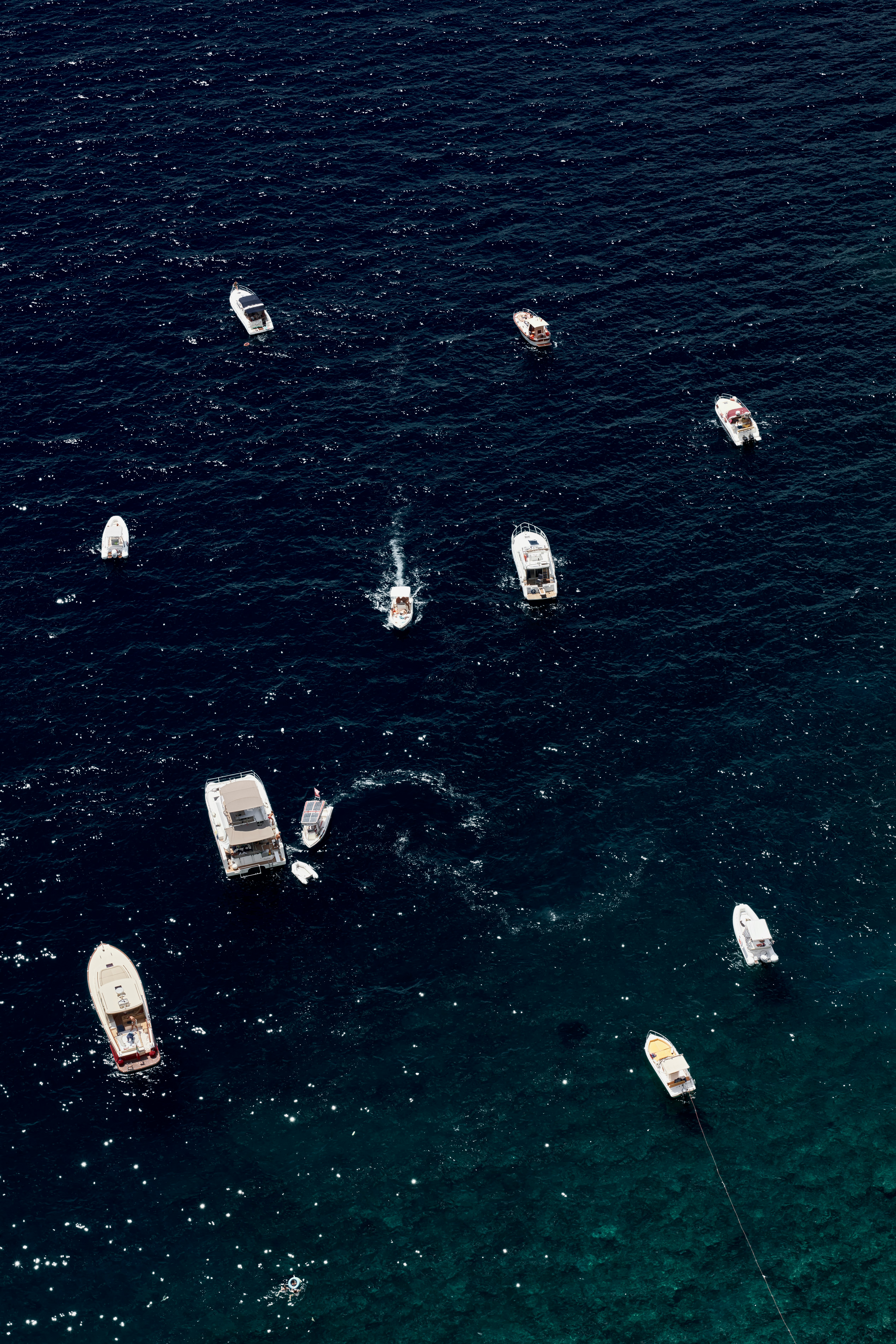 white boats on body of water during daytime